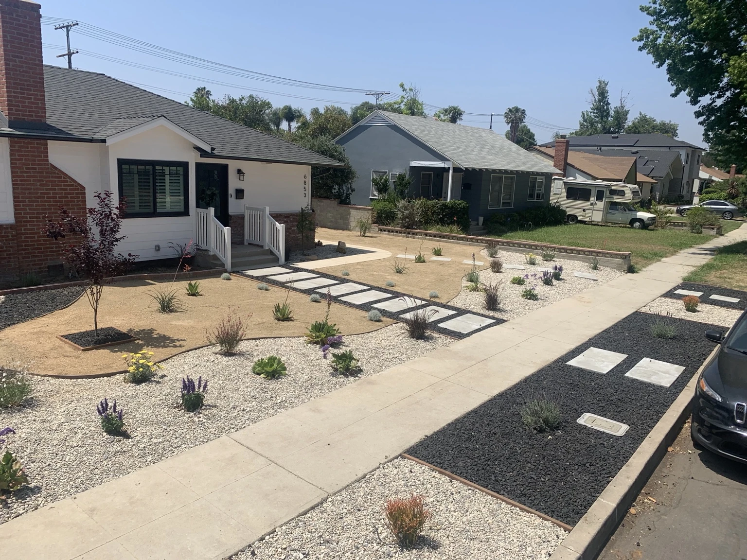 Front yard planting with gravel and walkways