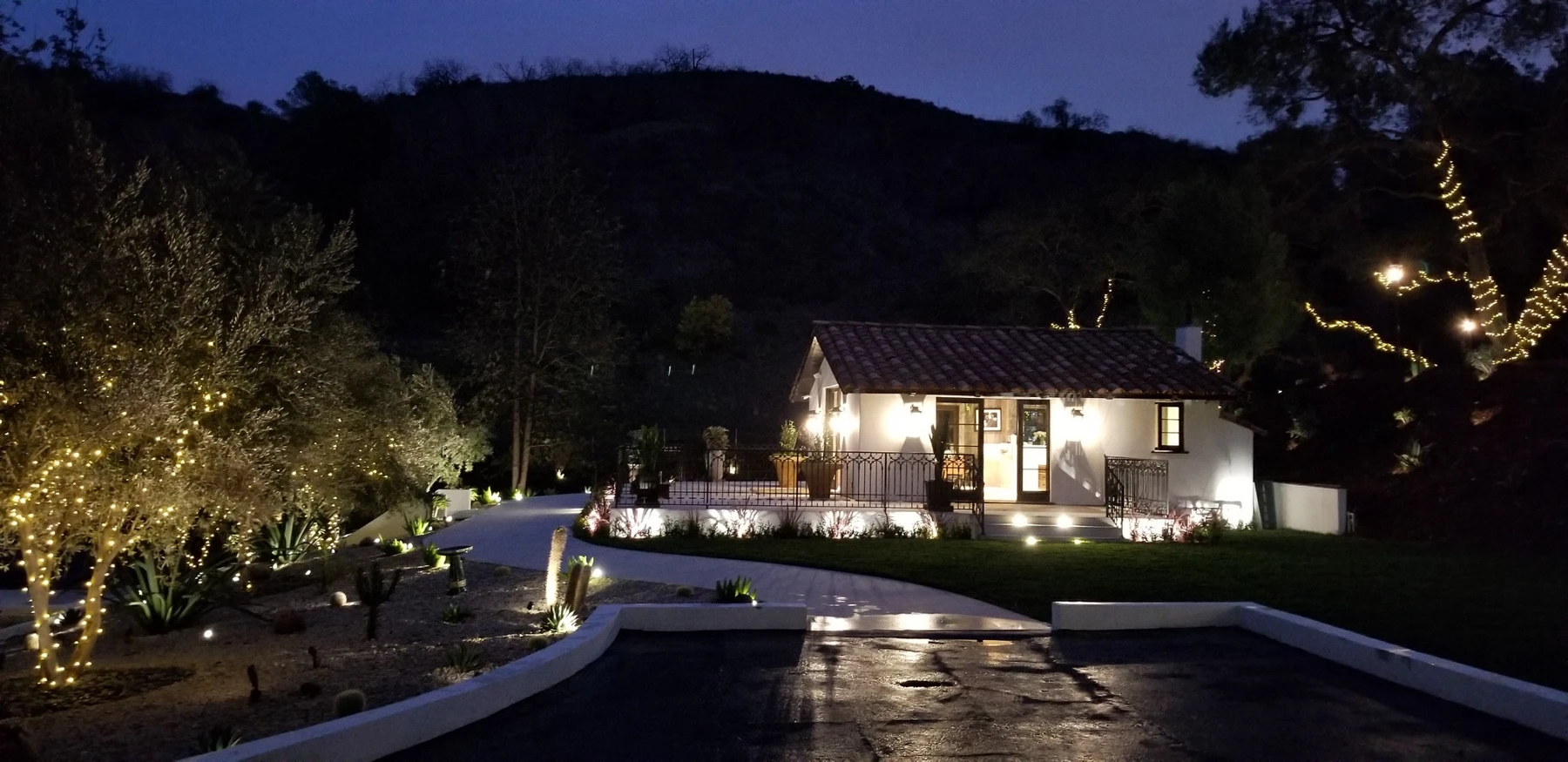 Landscape lighting around an outdoor living space